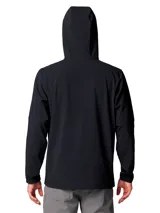 Chaqueta tipo softshell con capucha, color negro, cierre frontal completo y logo de Columbia bordado en el pecho izquierdo. Presenta puños elásticos y un dobladillo trasero más largo para mayor cobertura.