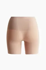 Culotte color piel con efecto moldeador en cintura, muslos y glúteos. Modelo de tiro alto con refuerzo interior y diseño seamless.