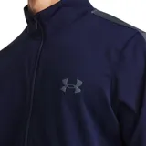 Conjunto deportivo Under Armour de hombre, compuesto por campera con cierre y pantalón largo. Diseño negro con detalles de franjas blancas en mangas y piernas, y logo de la marca en blanco.