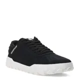 Zapatillas Caterpillar Hex + de corte bajo, color negro, con capellada de gamuza y detalles acolchados en el cuello. Cuentan con cordones negros y una suela gruesa de goma blanca con relieve de panal de abeja.