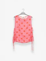 Musculosa de viscosa y poliamida con estampado de flores, con lazos en los costados.