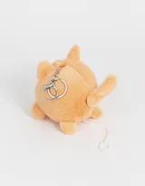 Llavero de peluche con forma de perro Shiba Inu color naranja con detalles en blanco y negro.