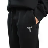 Pantalón de jogging negro con cordón ajustable en la cintura y logo estampado en blanco.