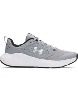 Championes Under Armour Charged Commit TR 4, color gris con detalles en blanco y negro.