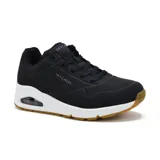 Championes Skechers Street Uno Stand on Air, color negro con detalles blancos y suela marrón. Capellada sintética con perforaciones, cordones y plantilla Air Cooled Memory Foam.