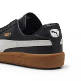 Championes Puma Army Trainer, color negro con detalles en blanco y suela color caramelo.