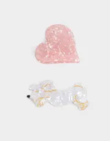 Set de dos broches para el pelo: uno con forma de corazón rosa y otro con forma de caniche blanco con detalles dorados.