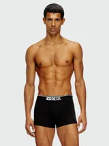 Boxer negro de algodón con cintura elástica blanca con logo Diesel en negro.