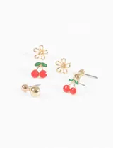 Set de tres pares de aros dorados con forma de flor, cereza y esfera.