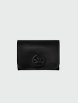 Billetera Longchamp modelo Box-Trot de cuero color azul con logo en relieve.
