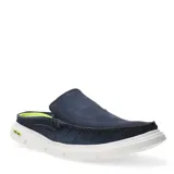 Mocasines Democrata YUGUI descalzo atrás, color azul jean, con suela blanca y plantilla verde flúor.