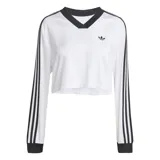 Remera corta blanca de mangas largas con cuello en V y tres tiras negras en los hombros.