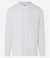 Remera de manga larga color blanco, confeccionada en algodón, con cuello redondo y puños ajustados.