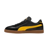 Championes Puma Club LI Era de cuero sintético negro con detalles en amarillo y suela color caramelo.