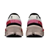 Championes de running On Cloudmonster 2, color blanco con detalles en negro, rojo y rosa.