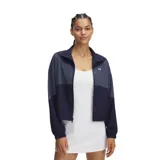 Campera Under Armour de mujer, color lila y blanco, con cierre frontal y logo bordado en el pecho.