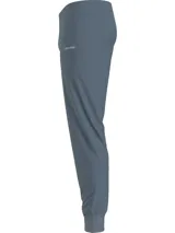 Joggers de algodón y Repreve en color azul, con cintura elástica, bolsillos laterales y logo de Calvin Klein en contraste.