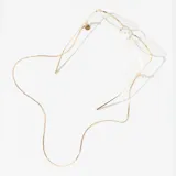 Correa dorada para lentes, hecha de metal con forma trenzada.