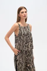 Blusa sin mangas de lyocell con estampado abstracto en tonos beige y negro, corte holgado.