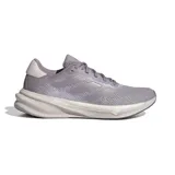 Championes de running Adidas Supernova Stride, color lila con detalles plateados y suela blanca.