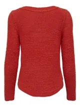 Sweater de punto color rojo ladrillo, de corte holgado y mangas largas.