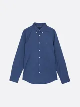 Camisa azul de popelín de algodón con tecnología Flex, cuello abotonado, puños redondeados con botón, logo de Tommy Hilfiger bordado en el pecho y corte regular.