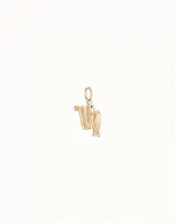Dije dorado con forma del signo zodiacal Virgo.