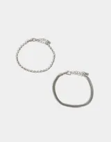 Set de dos pulseras plateadas, una con cadena de strass y otra con cadena snake.
