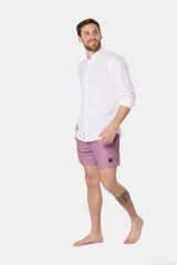 Short de baño clásico azul con estampado de palmeras, con cintura elástica y cordón regulable, dos bolsillos laterales y suspensor de malla fina.