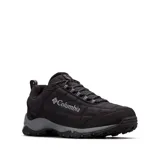 Zapatilla deportiva Columbia Firecamp Fleece III, color negro con detalles en gris oscuro. Presenta una parte superior textil acolchada y forro polar interior para abrigo. Cuenta con entresuela TechLite™ para amortiguación y suela Omni-Grip™ para tracción.