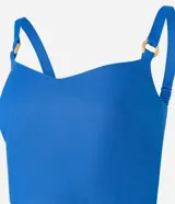 Blusa cropped de viscolino azul con escote en V, breteles con adornos y lastex en la espalda.