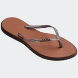 Ojotas Havaianas Slim Point color naranja con borde fucsia y logo fucsia en la tira.