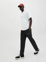 Pantalón de jogging negro de algodón con cintura elástica y cordón ajustable.