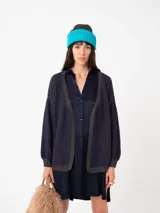 Cardigan tejido extra calentito con manga globo y cuerpo rayado que incorpora hilo de lurex.
