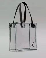 Bolso tote transparente con ribetes negros y logo Jordan en negro. Asas de mano negras.