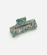 Pinza rectangular mediana para el pelo, hecha de plástico con efecto abulón en tonos beige, celeste y verde.