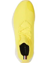 Zapatillas de running Tommy Hilfiger color amarillo, confeccionadas en tejido de punto elástico de poliéster reciclado, con cordones, suela dentada y plantilla de acupresión.