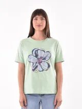 Remera blanca de algodón con estampado de limones y texto en azul.