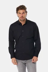 Camisa azul marino de manga larga con bolsillo en el pecho, confeccionada en algodón.