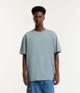 Remera relaxed de algodón con efecto grueso, color azul marino, cuello redondo y manga corta.