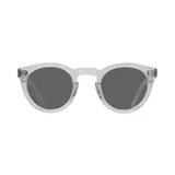 Lentes de sol con montura redonda transparente y lentes grises.