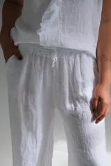 Pantalón palazzo blanco de lino italiano, con cintura elastizada.