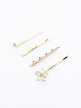 Set de cuatro hebillas para el pelo color dorado, con apliques de strass, perlas y flor calada.