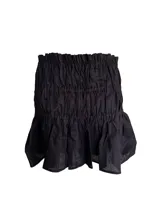 Minifalda negra de lino con detalle fruncido en todo el cuerpo y ruedo con volado amplio. Tiene cintura elástica.