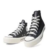 Championes de caña alta Converse Chuck Taylor All Star Lift, color negro con efecto iridiscente y plataforma blanca.