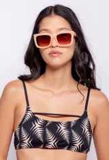 Top de bikini negro con estampado de hojas color beige, breteles finos fijos y gancho en la espalda. Con forro y copas desmontables.