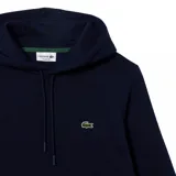 Buzo canguro azul marino de Lacoste con capucha y logo bordado en el pecho.