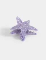 Broche con forma de estrella de mar color lila con incrustaciones de strass.