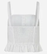 Blusa corset de laise blanca con bordado de flores, escote cuadrado, breteles y volados en el ruedo. Cierre frontal con corchetes.