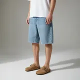 Zuecos color beige con hebilla ajustable.